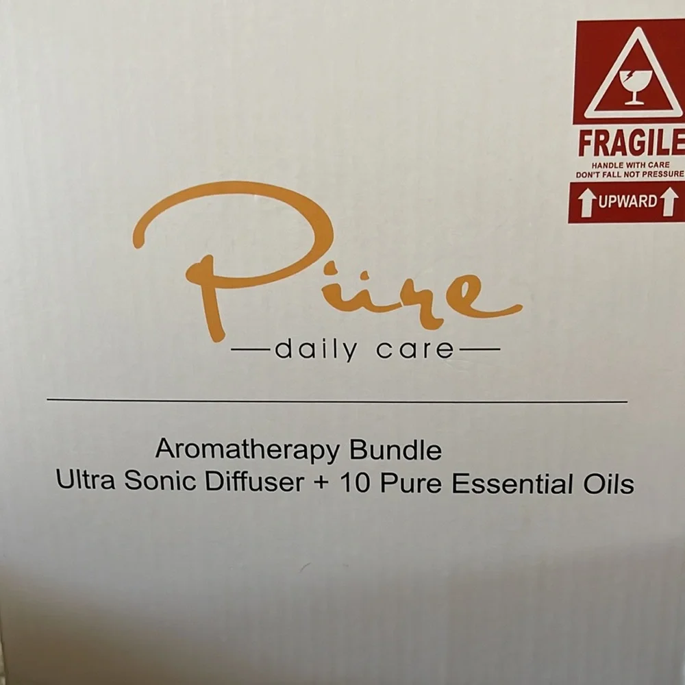 NIB Pure Daily Care Ultrasonic Aromatherapy Diffuser with 10 Pure Essential Oils